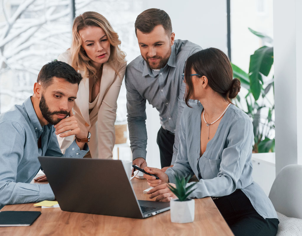 internet connection by using laptop. group of business people that working on the project in the office