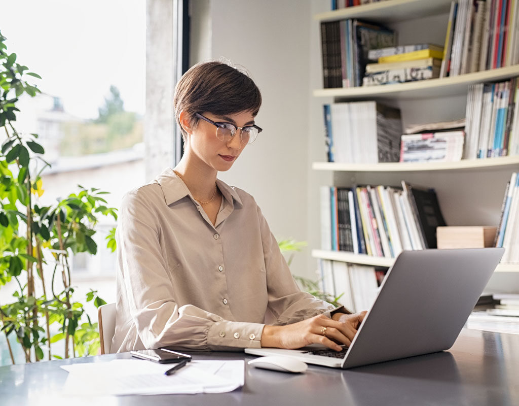 young woman working on laptop