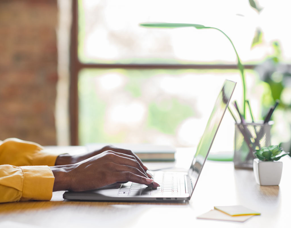 profile photo of girl hands typing on laptop table wear yellow shirt at home